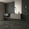 Baño con pavimento Gold Nero 60x120